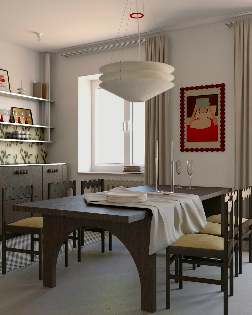 A Clérachic three-tier pendant hangs in a dining room with a dark wood table, yellow-seated chairs and shelves along one wall.