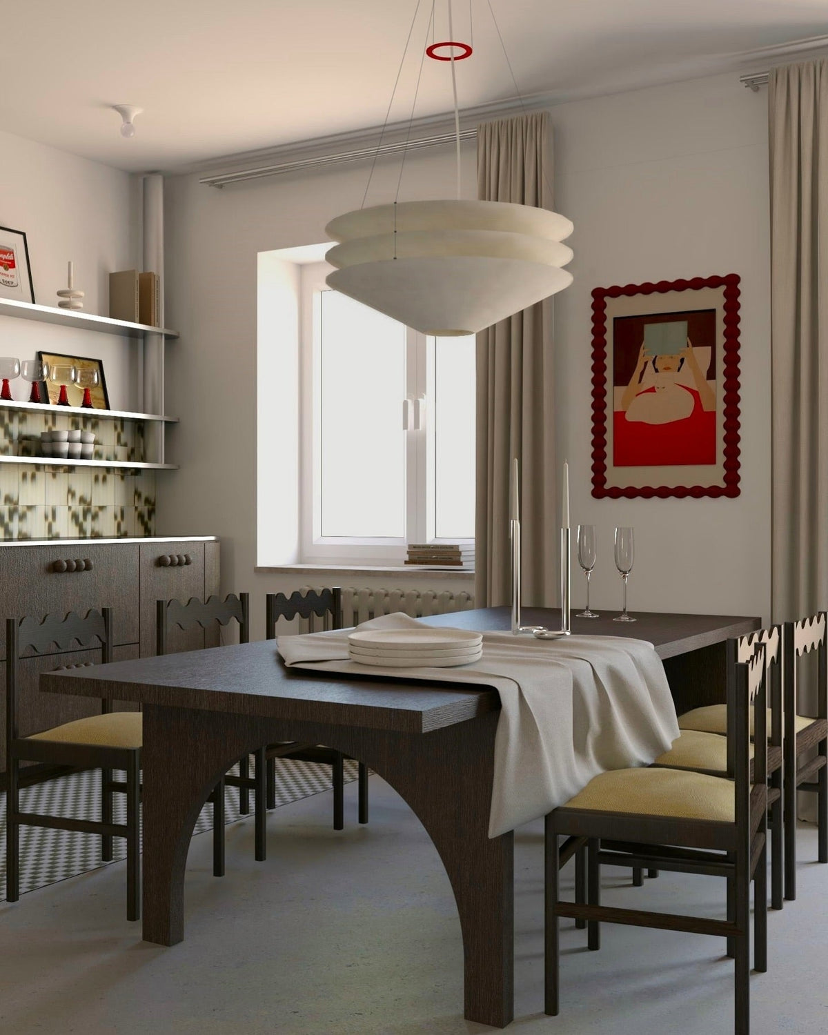A Clérachic three-tier pendant hangs in a dining room with a dark wood table, yellow-seated chairs and shelves along one wall.