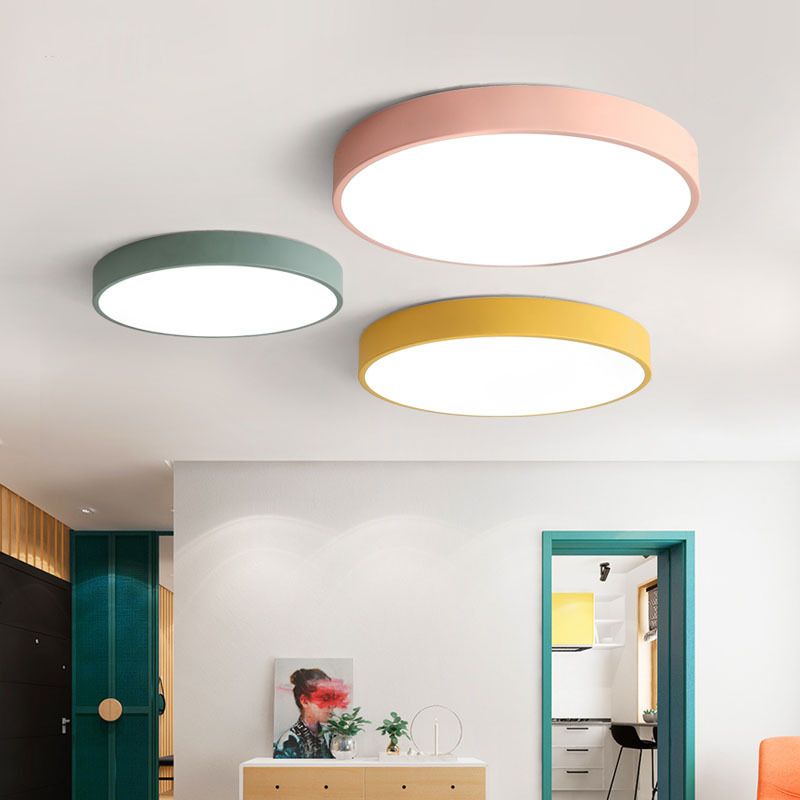 Pink, sage-green, and mustard Clérachic flush mount ceiling lights are grouped above a hallway entry.