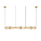 Clérachic gallery view of nine textured stone pebbles hanging in a line below four fine cords and gold canopies, on a plain white background.
