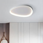 Clérachic white teardrop-shaped ceiling light glowing around its rim above white wardrobes and a round hanging mirror.