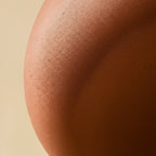 Close detail of the Clérachic terracotta pink shell, showing its fine matte grain and soft shadowed curve.