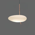 Clérachic pebble pendant glowing softly against a dark gray backdrop, its rose gold stem and angled tip clearly visible.