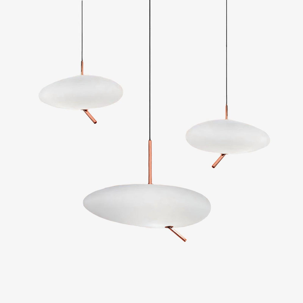 Three Clérachic pebble pendants shown unlit at different heights on white, revealing the frosted shade's matte tone.