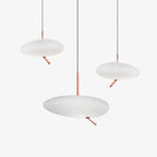 Three Clérachic pebble pendants shown unlit at different heights on white, revealing the frosted shade's matte tone.