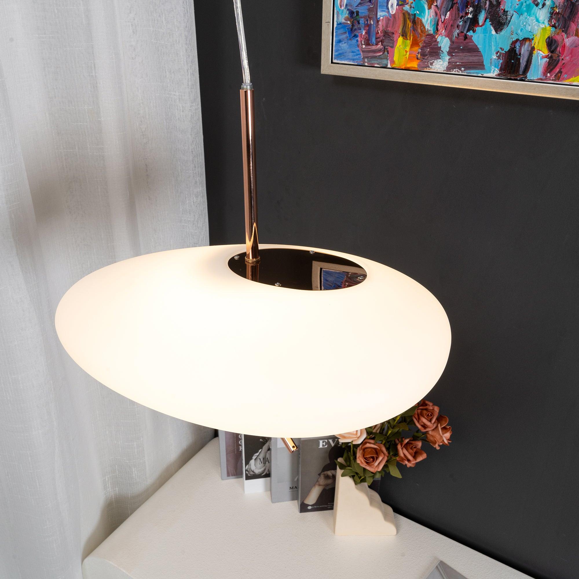 Clérachic pendant hardware seen from another angle, with the same abstract painting and rose vase nearby.