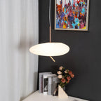 The full Clérachic fixture drops beside the same painting and roses, its stem and canopy fully visible here.