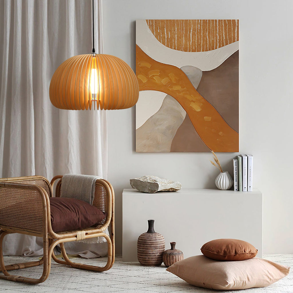Clérachic wooden pendant lit beside a large abstract painting in ochre and brown, above a rattan chair and ceramic vases.