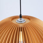 Close view of the chrome cord grip and the closely spaced slats at the crown of this Clérachic wooden pendant.