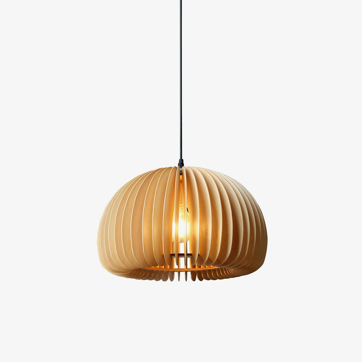 A Clérachic dome pendant in pale, light wood slats on a plain off-white backdrop, with the bulb faintly visible through the shade.