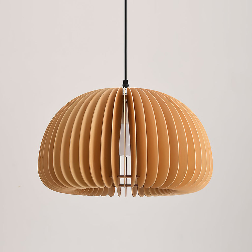 Large Clérachic slatted pendant on a black cord against a pale wall, with soft shadows between the curved slats.