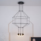 Lit black wireframe pendant on a round ceiling canopy, with a tiered cage and eight small lights below, against a white arched wall, from Clérachic.