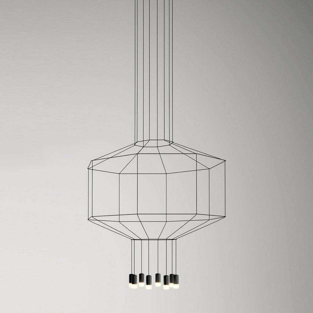 Octagonal black cable cage pendant with a cluster of light heads below, on a soft grey backdrop, from Clérachic.
