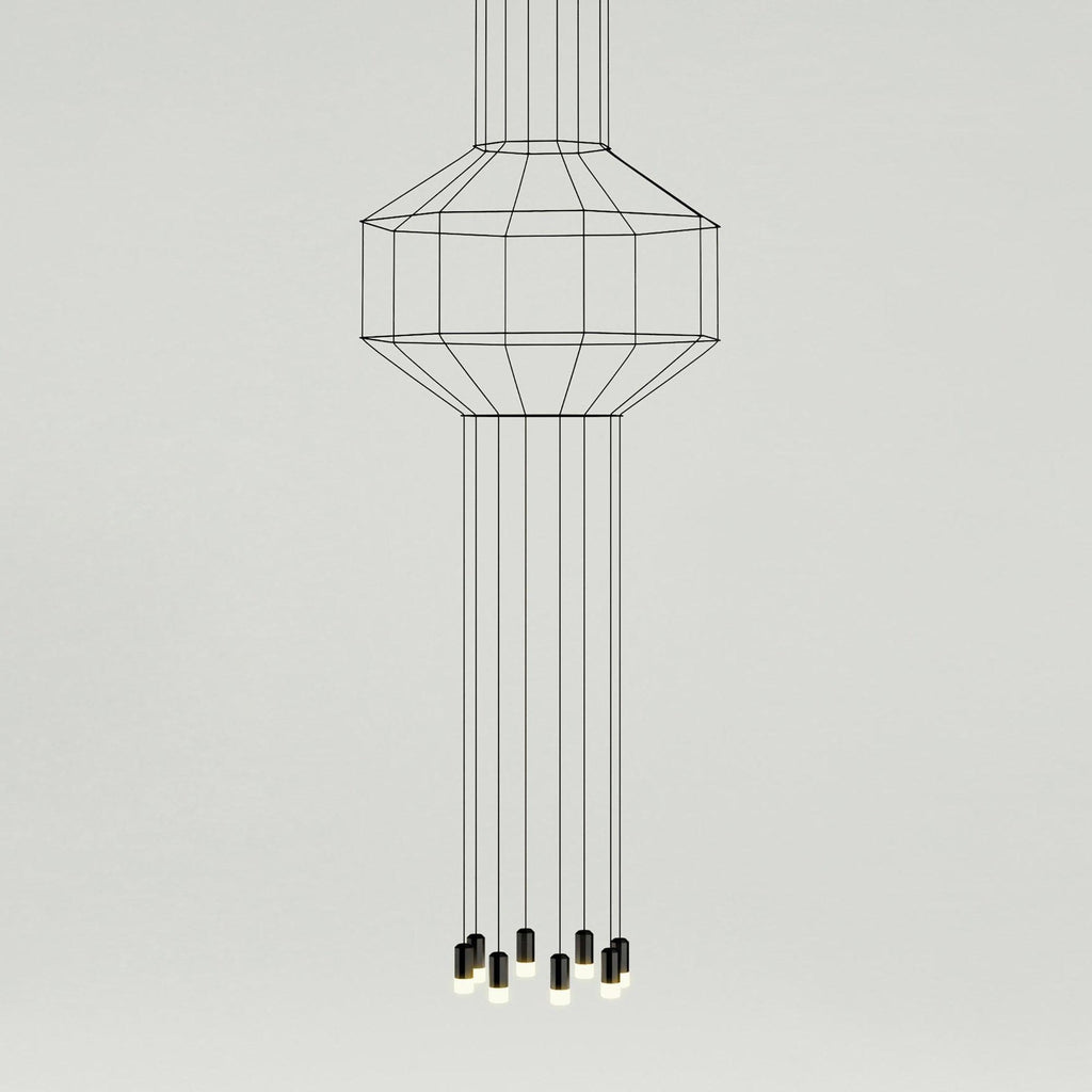 Tall cable-frame pendant with a slim cage at the top and long straight cables dropping to a cluster of lights, from Clérachic.
