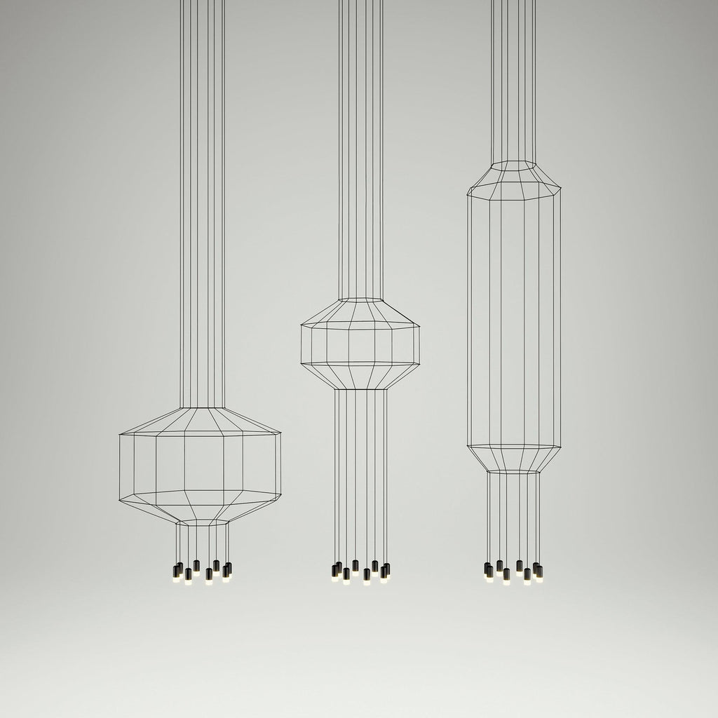 Three Clérachic wireframe pendants in different sizes, from short to tall, hung in a row on a pale studio backdrop.