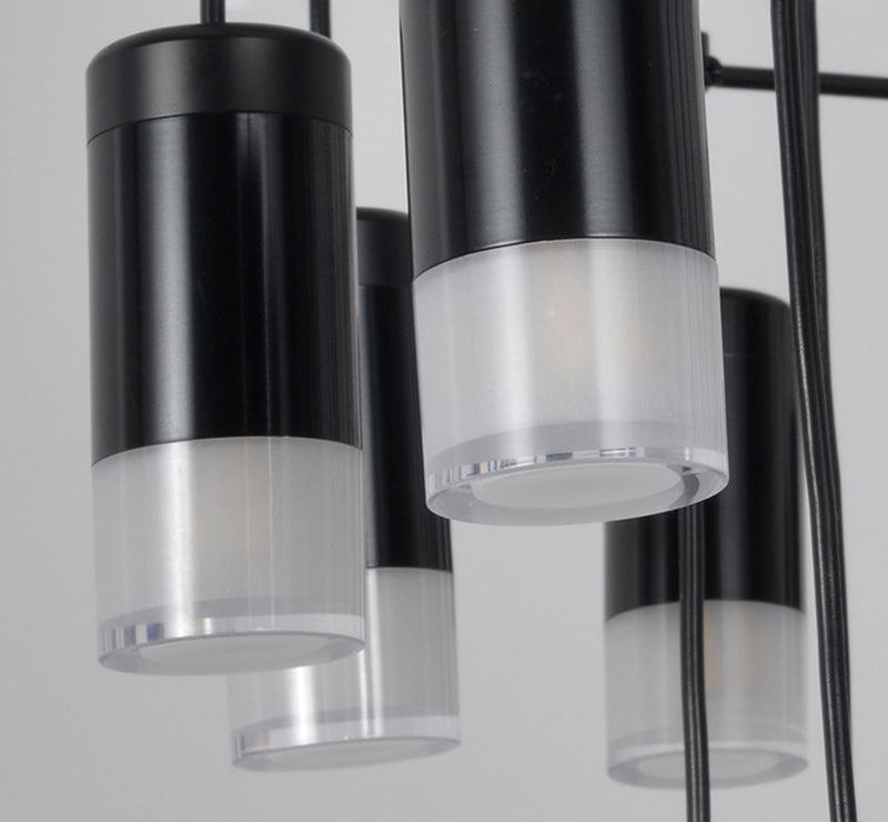 Close view of the black metal light heads and frosted clear diffusers on this Clérachic wireframe pendant.