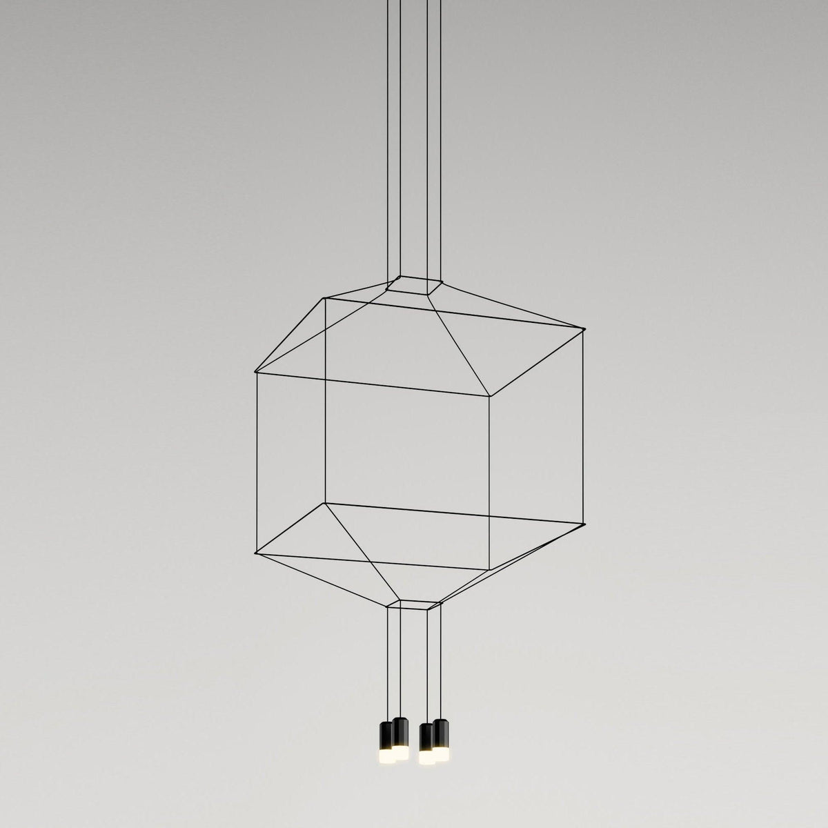 Cube-shaped cable-frame pendant with two small lights hanging beneath, on a plain grey backdrop, from Clérachic.
