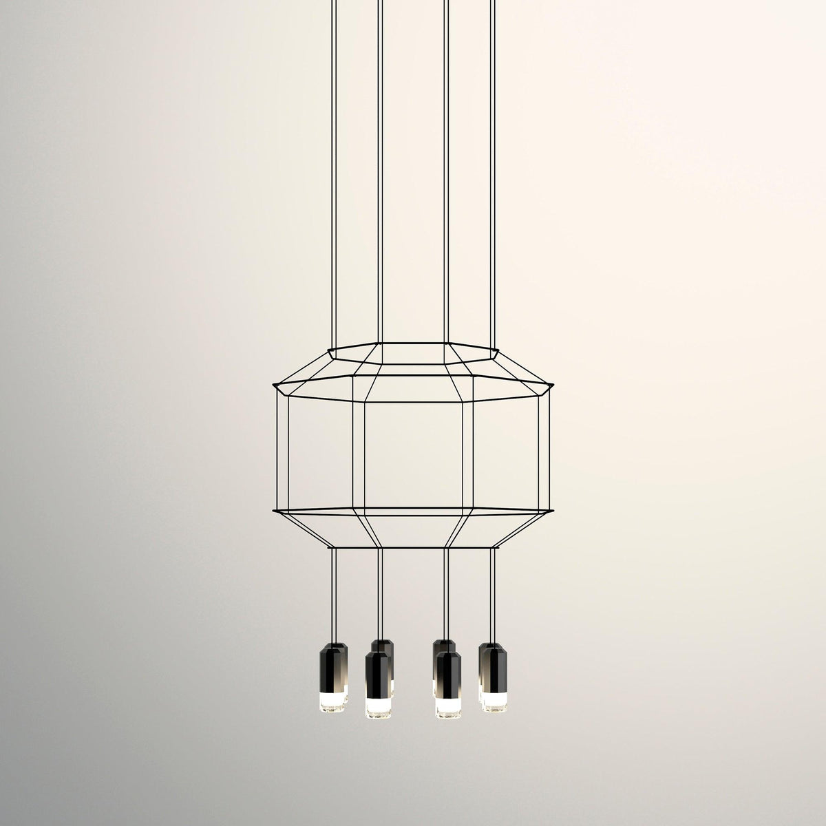 Octagonal two-tier wireframe pendant with four black light heads below, on a warm cream backdrop, from Clérachic.