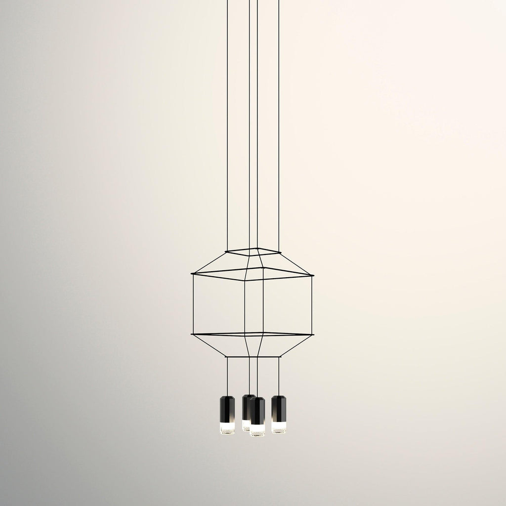 Small cable-frame pendant with a squat cage and three black light heads below, on a cream backdrop, from Clérachic.