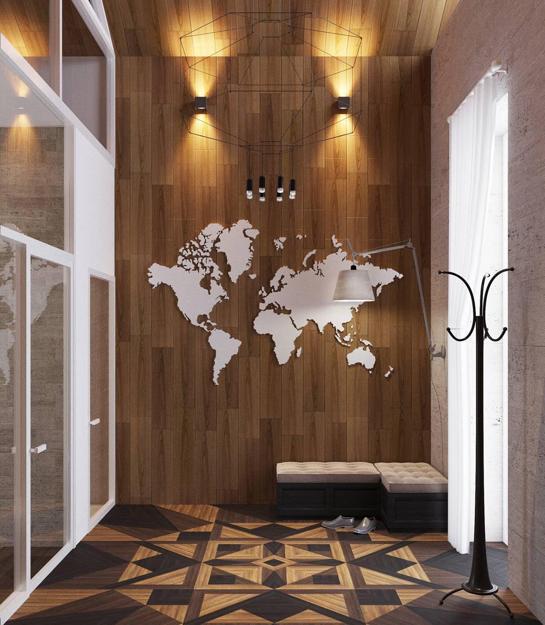 Clérachic wireframe pendant in a timber-clad entrance hall with a world map on the wall and a coat stand.