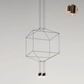 Cube-shaped wireframe pendant with two small lights below, on a pale grey backdrop, with a small detail inset, from Clérachic.