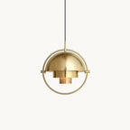 Gold-toned Clérachic pendant with a domed shade and stepped inner cylinders, held in a round frame, on a plain white backdrop.