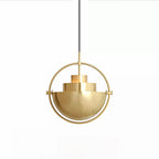 Gold-toned Clérachic pendant with a thin ring and a stepped inner shade, on a plain white backdrop.