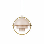 Blush-pink Clérachic pendant with a stepped shade in a gold ring, on a plain white backdrop.