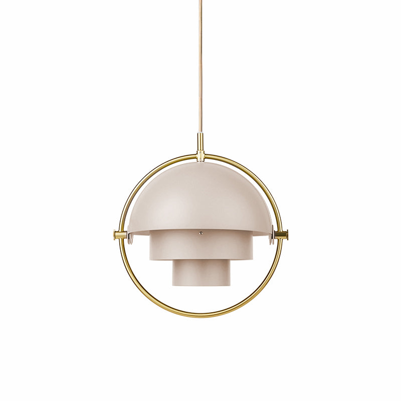 Soft blush Clérachic pendant with a gold ring and a stepped inner shade, on a plain white backdrop.
