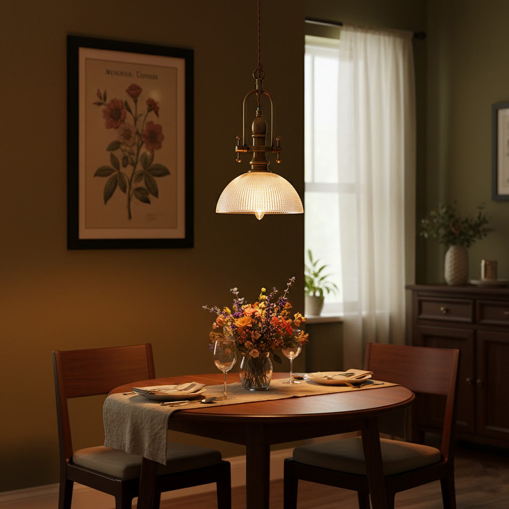 In a dim olive-walled dining room, this Clérachic pendant glows warm above a round table with dried flowers.