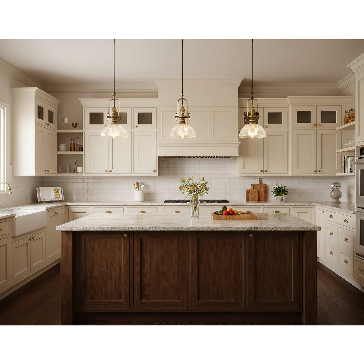 Three Clérachic pendants in a row above a dark wood island in a white kitchen with a farmhouse sink.