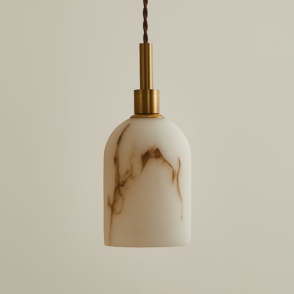 Cylindrical faux alabaster shade with brown veining under a brass cap on this Clérachic pendant light, with a twisted brown cord.