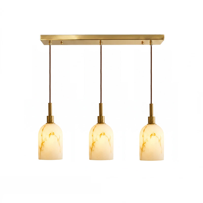 Three-light bar version of this Clérachic pendant light, with three veined cylinder shades hung from a brass rectangular canopy.