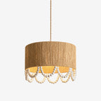 Studio view of this Clérachic pendant, a hemp rope drum shade with a scalloped wood-bead fringe beneath.