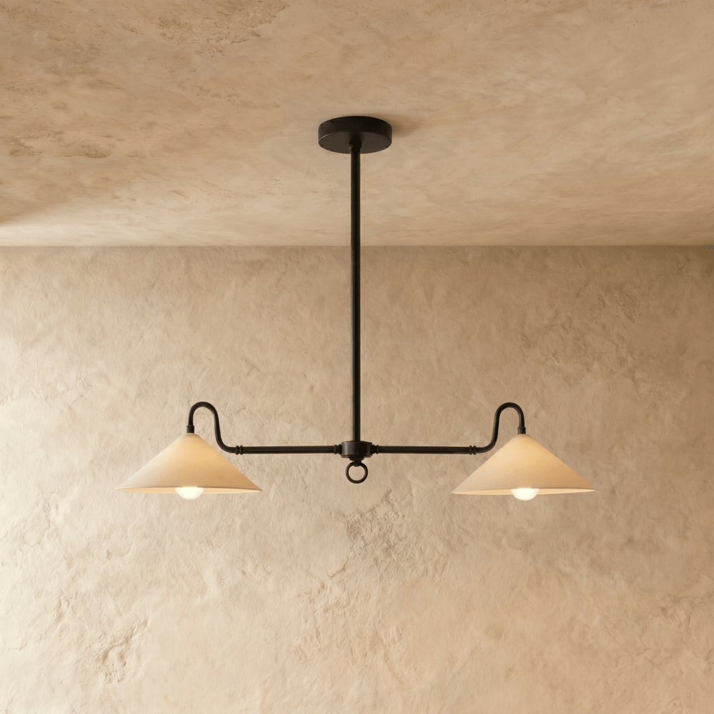 Clérachic pendant light in matte black, twin cone shades suspended from a single ceiling rod.