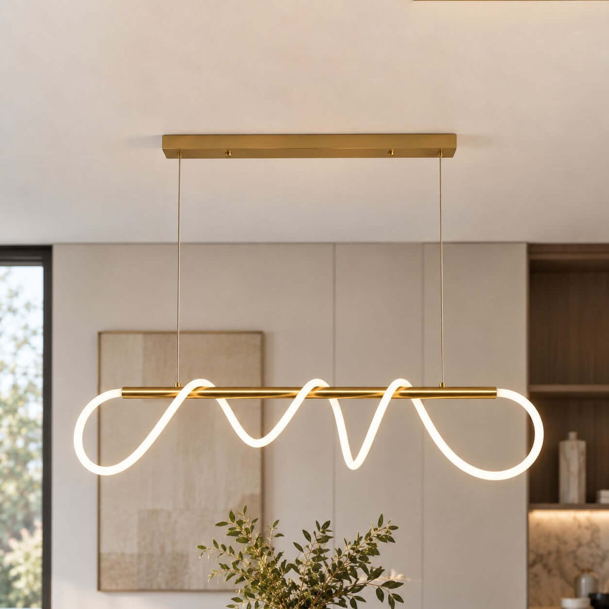 Close view of the lit silicone ribbon looping along the brass bar of this Clérachic linear pendant, with a soft artwork behind.