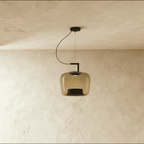Clérachic mid-size amber glass pendant with black inner reflector, unlit, on a curved black cord and arm.