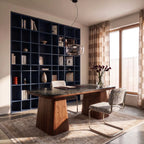 Clérachic wide pendant in pale grey glass hung over a study desk with a navy shelving wall behind.