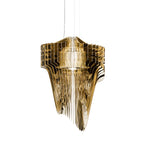 A Clérachic gold fringe pendant on white, with mirror-bright fins stacked in tiers and a soft light inside.