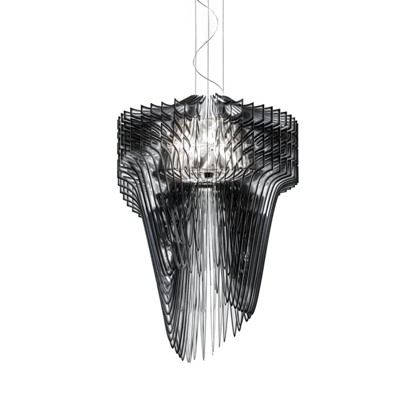 A Clérachic black fringe pendant on white, seen from slightly below with its dark fins falling in long, narrow strands.