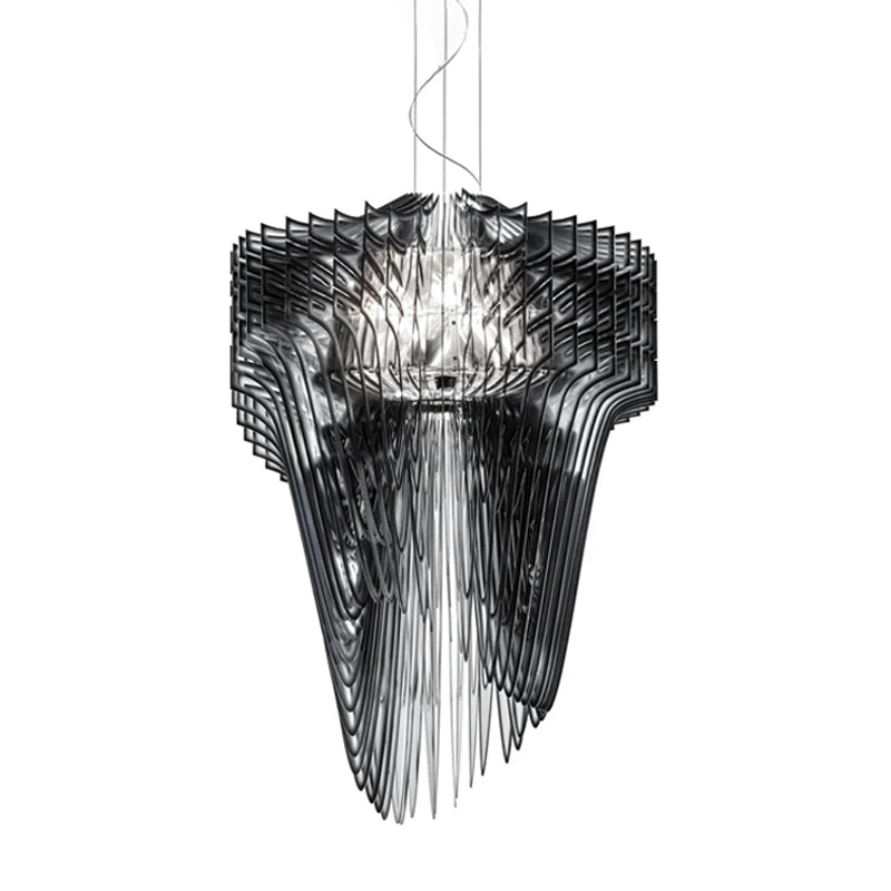 A smoky black acrylic fringe pendant from Clérachic, with a looped cable at the top and layered fins round a bright core.