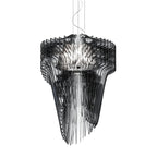A smoky black acrylic fringe pendant from Clérachic, with a looped cable at the top and layered fins round a bright core.