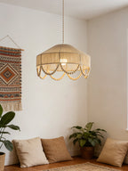 In a corner with floor cushions and a woven wall hanging, this Clérachic pendant casts a warm glow.