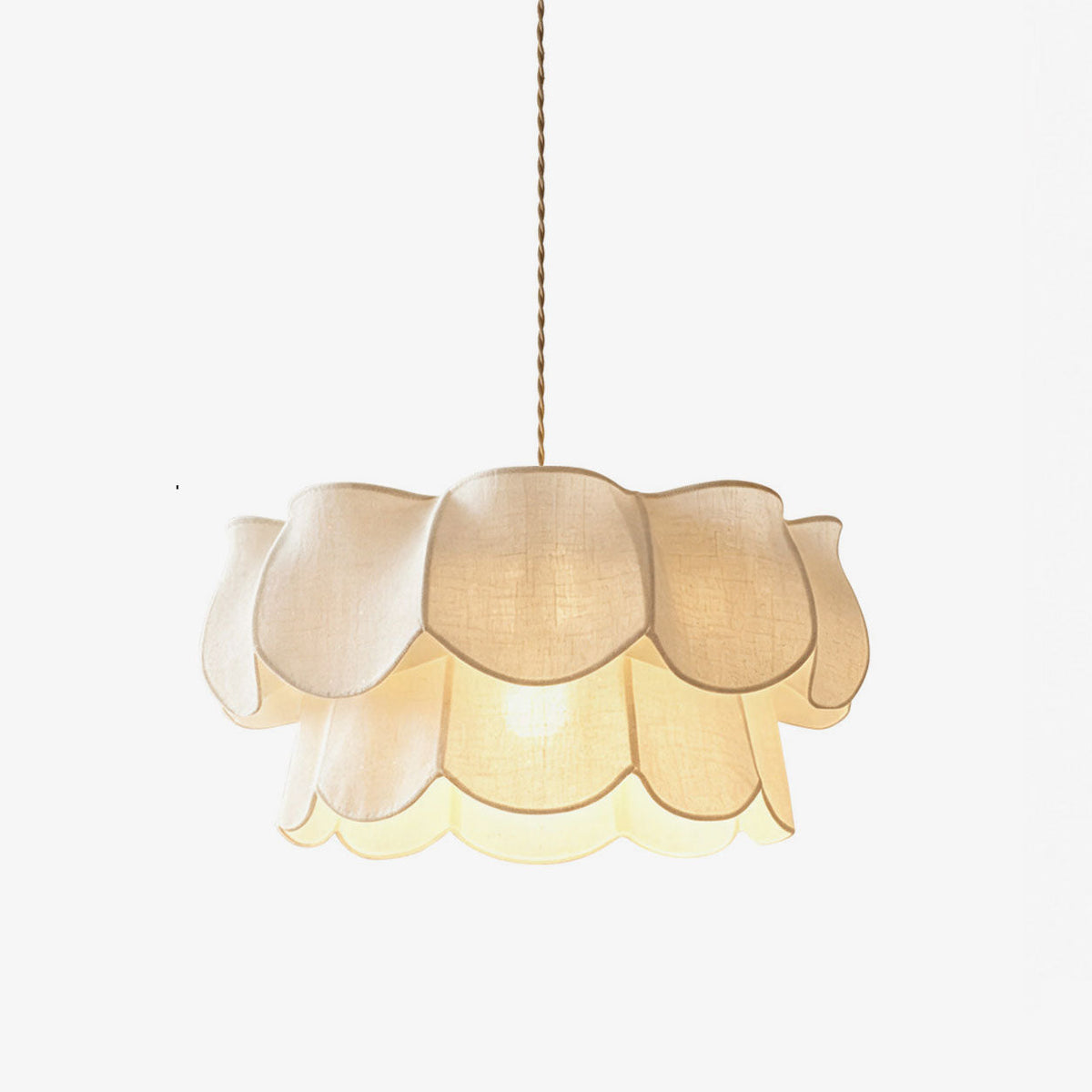 Close view of this Clérachic pendant's linen petals, stacked in two tiers around a glowing centre, on a plain backdrop.