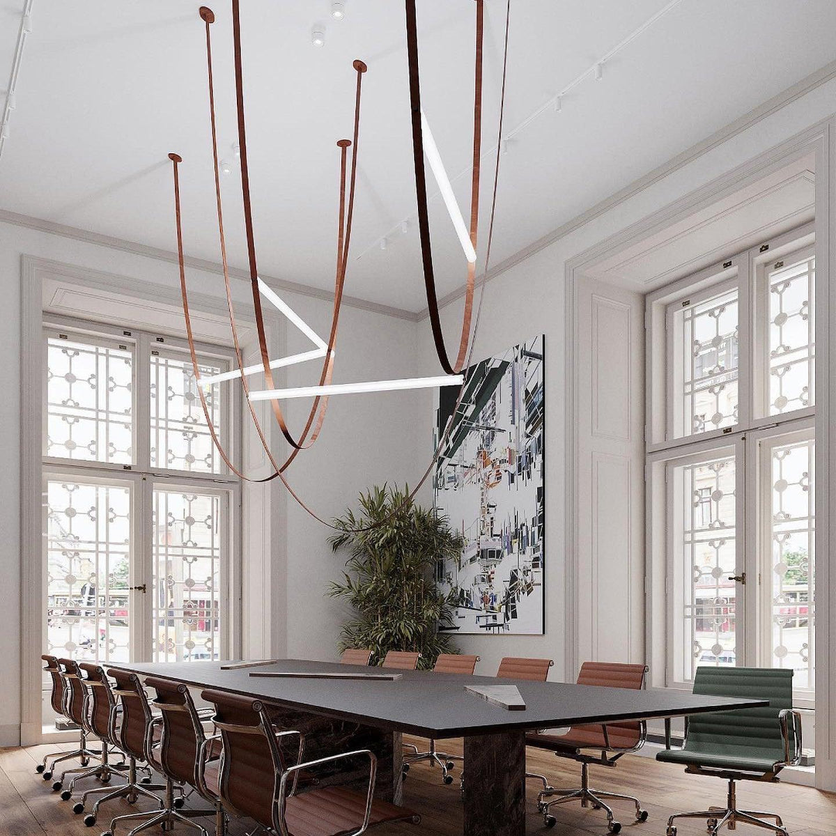 Light bars at several angles on leather loops, a Clérachic pendant hung in a tall meeting room above a long dark table.