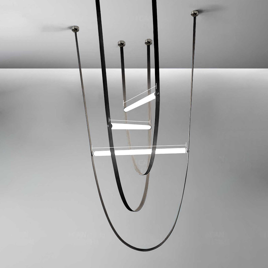 Render of this Clérachic pendant with dark leather loops, black canopy plates and three lit bars of different lengths on a grey backdrop.