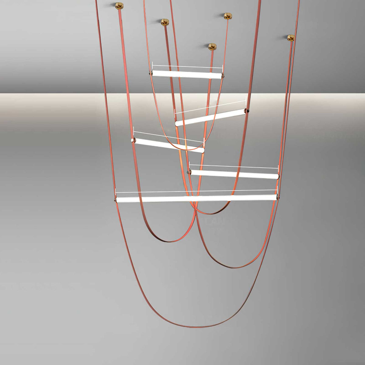 Five-bar render of this Clérachic pendant in copper-toned leather, with brass canopies and bars at staggered heights on grey.