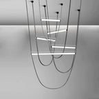 Five lit bars on black leather loops with black canopy plates, rendered for this Clérachic pendant on a grey backdrop.