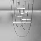 Render of this Clérachic pendant in black leather with brass canopy plates and five lit bars at staggered heights.