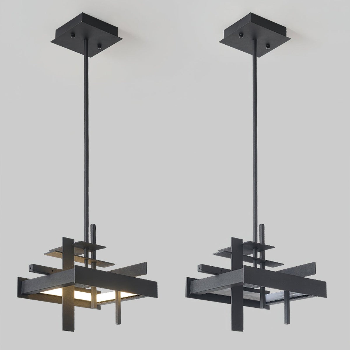 Two compact matte black Clérachic pendants, each with a square ceiling plate and a single rod, hang side by side on a pale backdrop.